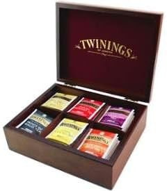 cesto natalizio con mix di tè, tisane e camomille, teiera e tazzine, scatola in legno e caddy porta bustine tè sfuso