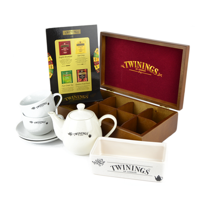 1 boîte de 8 compartiments + 2 tasses + un support en céramique + 160 sachets assortis